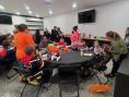 Kramer Homes Halloween party adults and children around tables eating