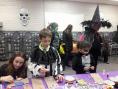 Kramer Homes Halloween party children in costumes participating in arts and crafts