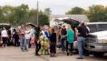 Kramer Homes Halloween party families by their cars coming together to attend the party