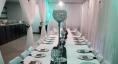 Angled shot of long table decorated for a wedding at Kramer Center