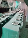 Alternate view of long table decorated fro a wedding at Kramer Center