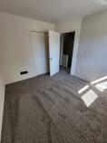 Angled view of empty bedroom at Kramer Homes